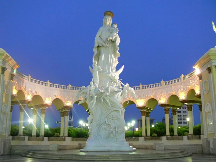 La Chinita Monument surrounded by illuminated arches at dusk