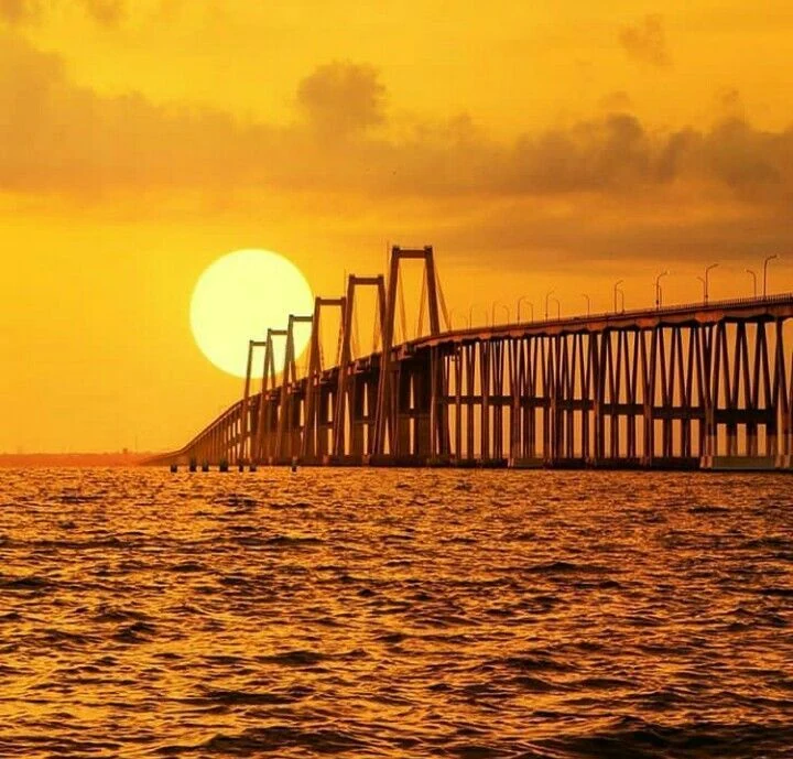 Sunset beside the General Rafael Urdaneta Bridge over Lake Maracaibo